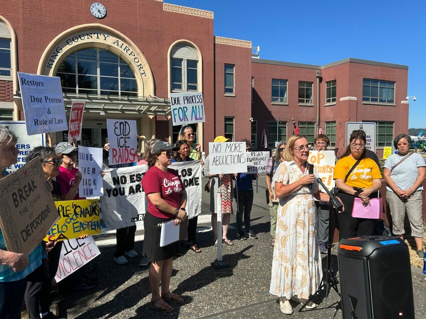 Angelina Godoy, director of the University of Washington Center for Human Rights, speaks to reporters alongside advocates outside Boeing Field in Seattle, Washington, on Tuesday, July 15, 2025. (Photo by Jake Goldstein-Street/Washington State Standard)