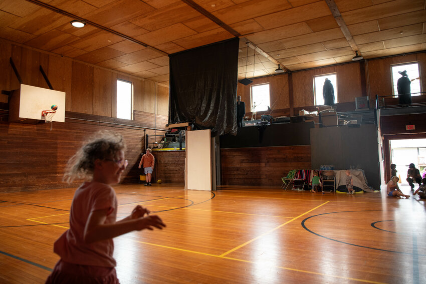 A boy shoots a basketball during an open gym at the site of the Bucoda Haunted House on Thursday, July 10.