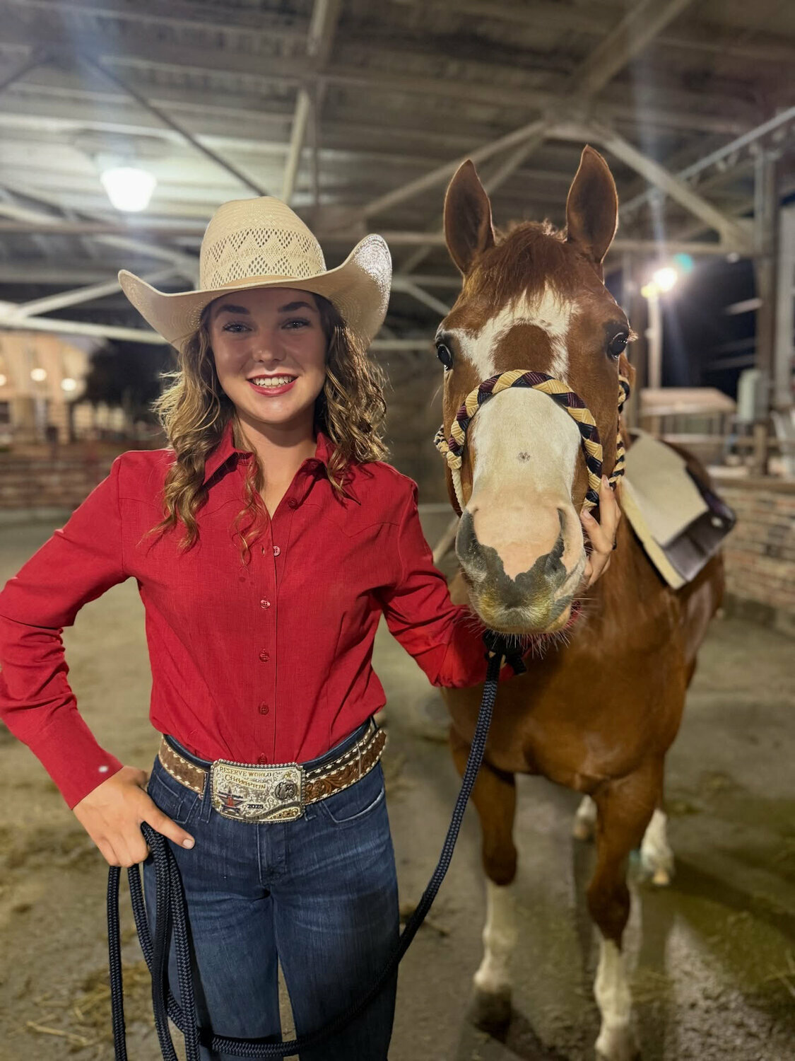 Brooklynn Bell, a homeschooled student from Rainier, poses for a photo with her horse Shirley.