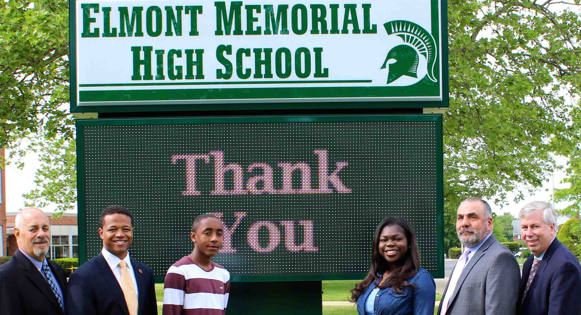Pictured from left, Superintendent of Schools Dr. Ralph Ferrie, 
Legislator Carrié Solages, Elmont Memorial high School sophomore Justin Palmer, senior Courtney Ihaza, Principal John Capozzi and Board of Education President David Fowler.