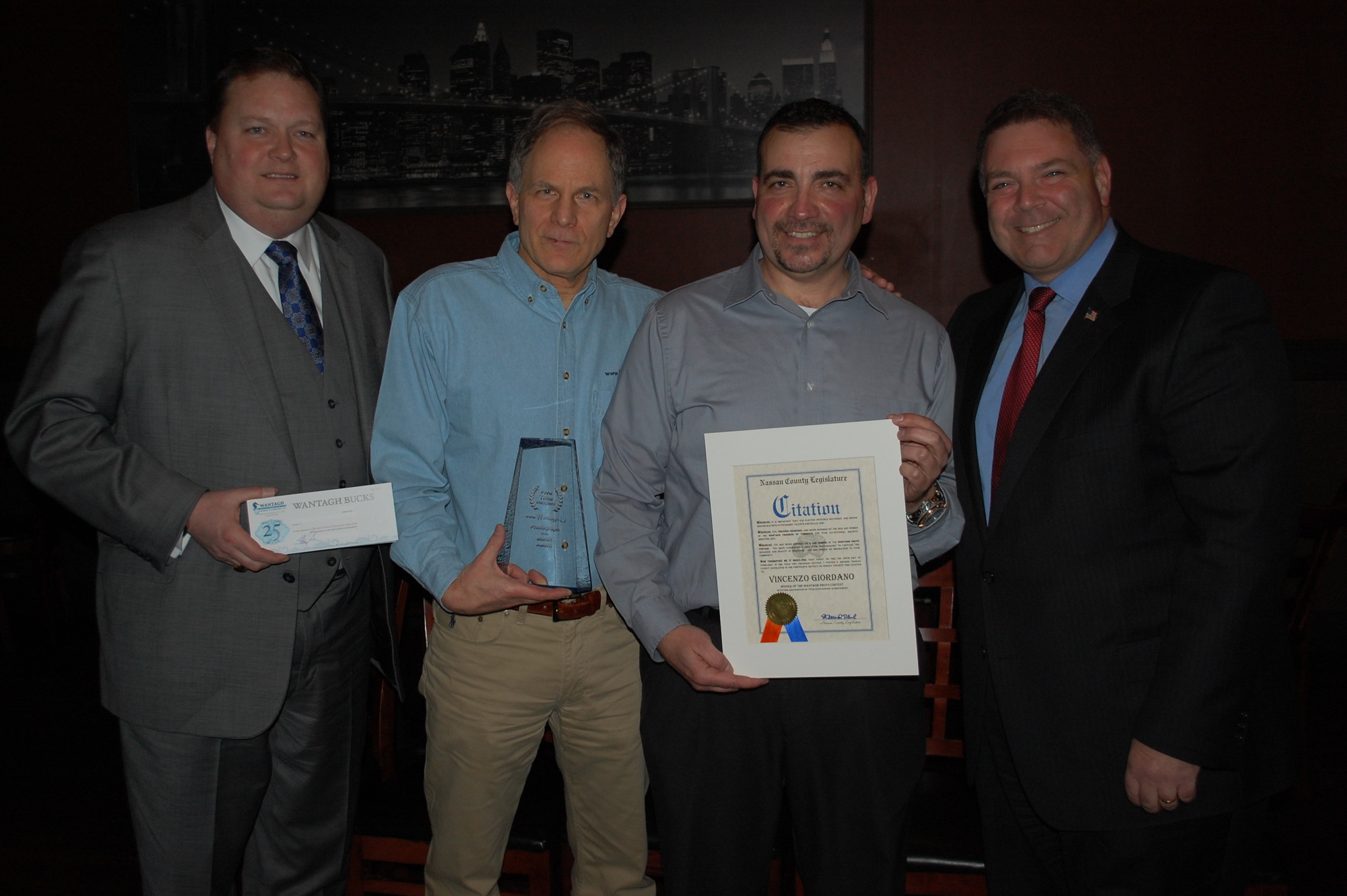 Vincenzo Giordano, second from right, was recognized as a five-time winner in the Wantagh.Li photo contest. Joining him were Chamber of Commerce President Chris Brown, Jim Colotti and Legislator Steve Rhoads.