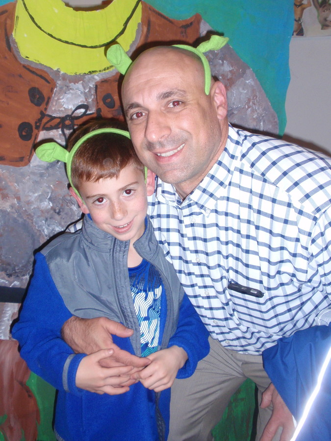 Principal Anthony Mignella and his son, Nicholas, 8, enjoyed the show.