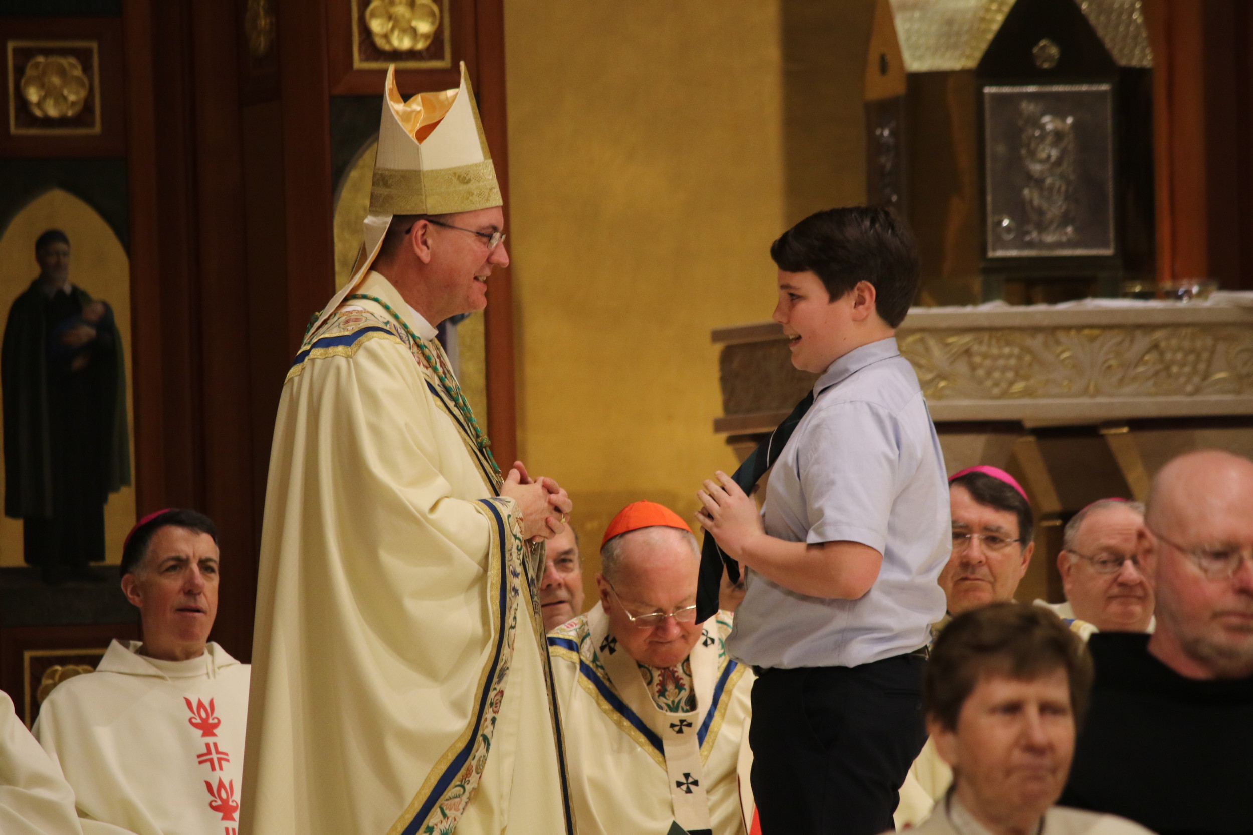 St. Agnes student greets bishop at historic Mass | Herald Community ...