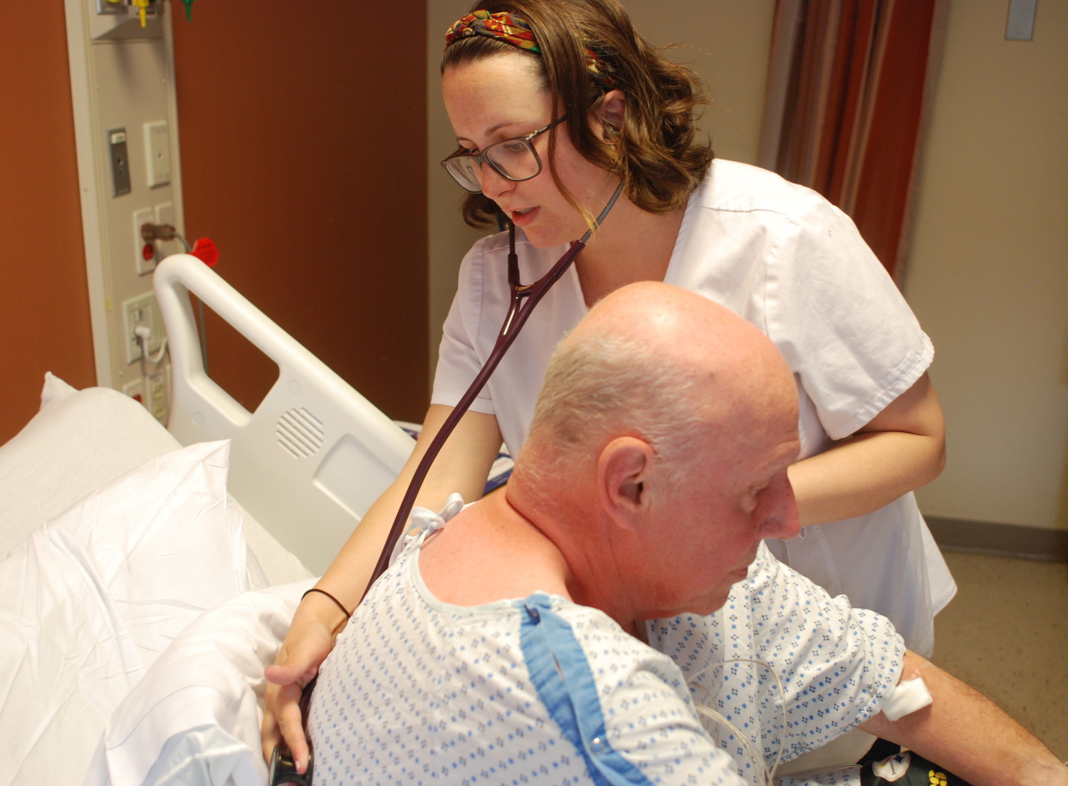 Kathryn Geraghty, a registered nurse in South Nassau Communities Hospital’s geriatric wing, checked the lungs of John Bores, of Oceanside, who suffers from a heart condition.