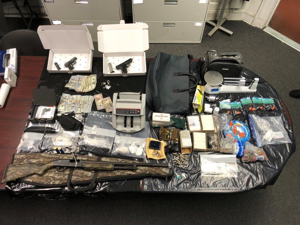 During the search of Robert Williams' house, investigators found an undisclosed amount of heroin, an undetermined amount of money, two loaded .380 caliber handguns, a loaded 12 gauge shotgun, ammunition, packing materials, scales and a money counting machine.