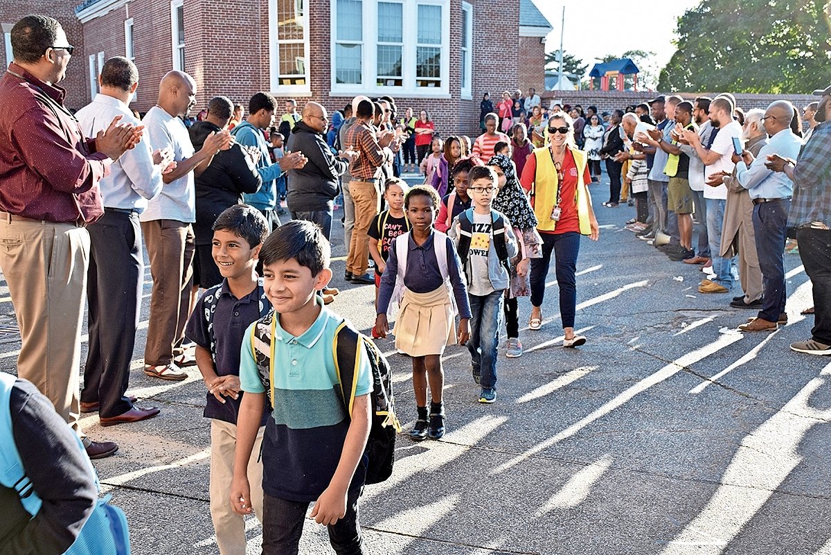 Alden Terrace dads bring kids to school Herald Community Newspapers