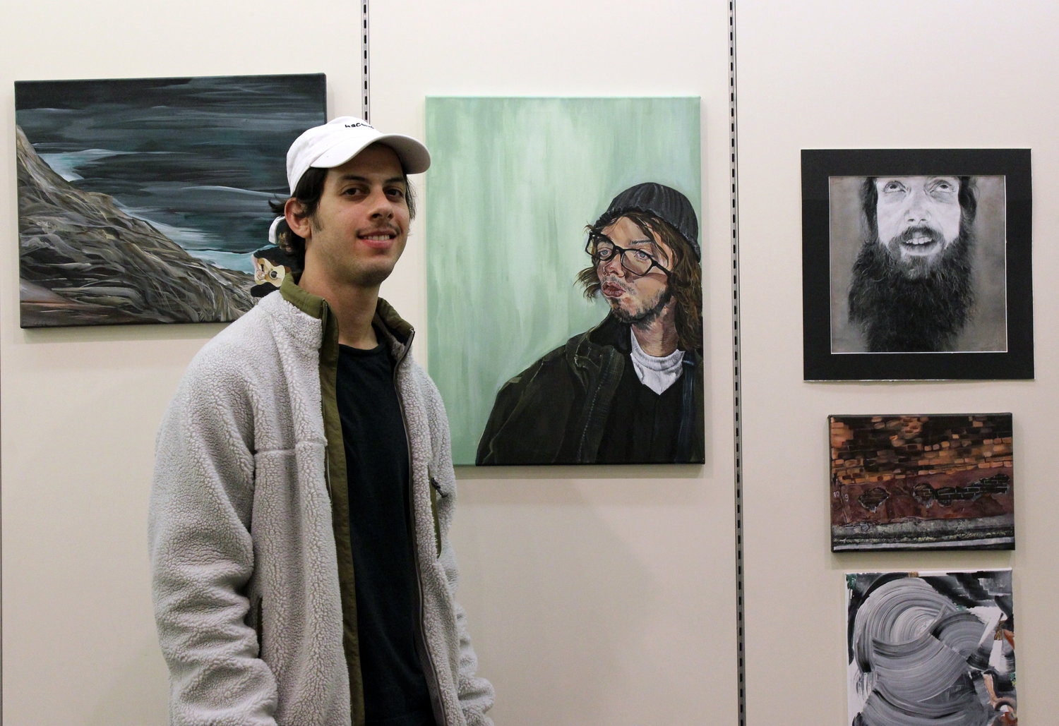 Andrew Albarracin, 27, of Massapequa Park, above was also featured in the show. More than a dozen local artists were invited by the library to display their work and connect with other artists.