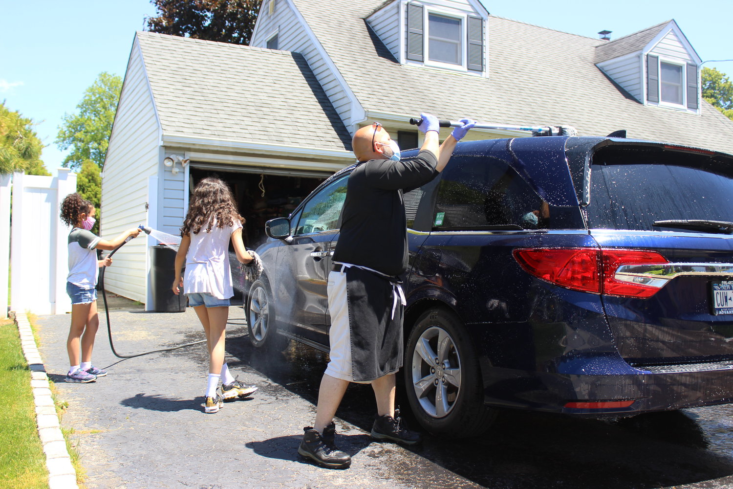 East Meadow family washes cars to support local causes Herald