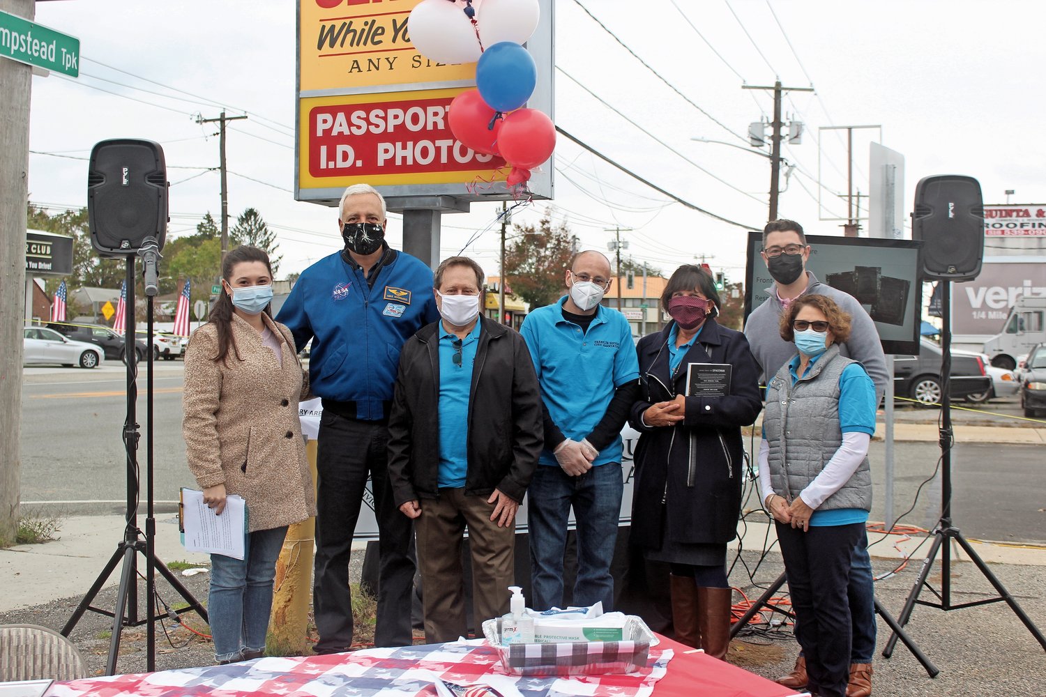 The Franklin Square Civic Association honored Mike Massimino, second from left, an astronaut from Franklin Square, with a Hometown Hero banner on Nov. 1.