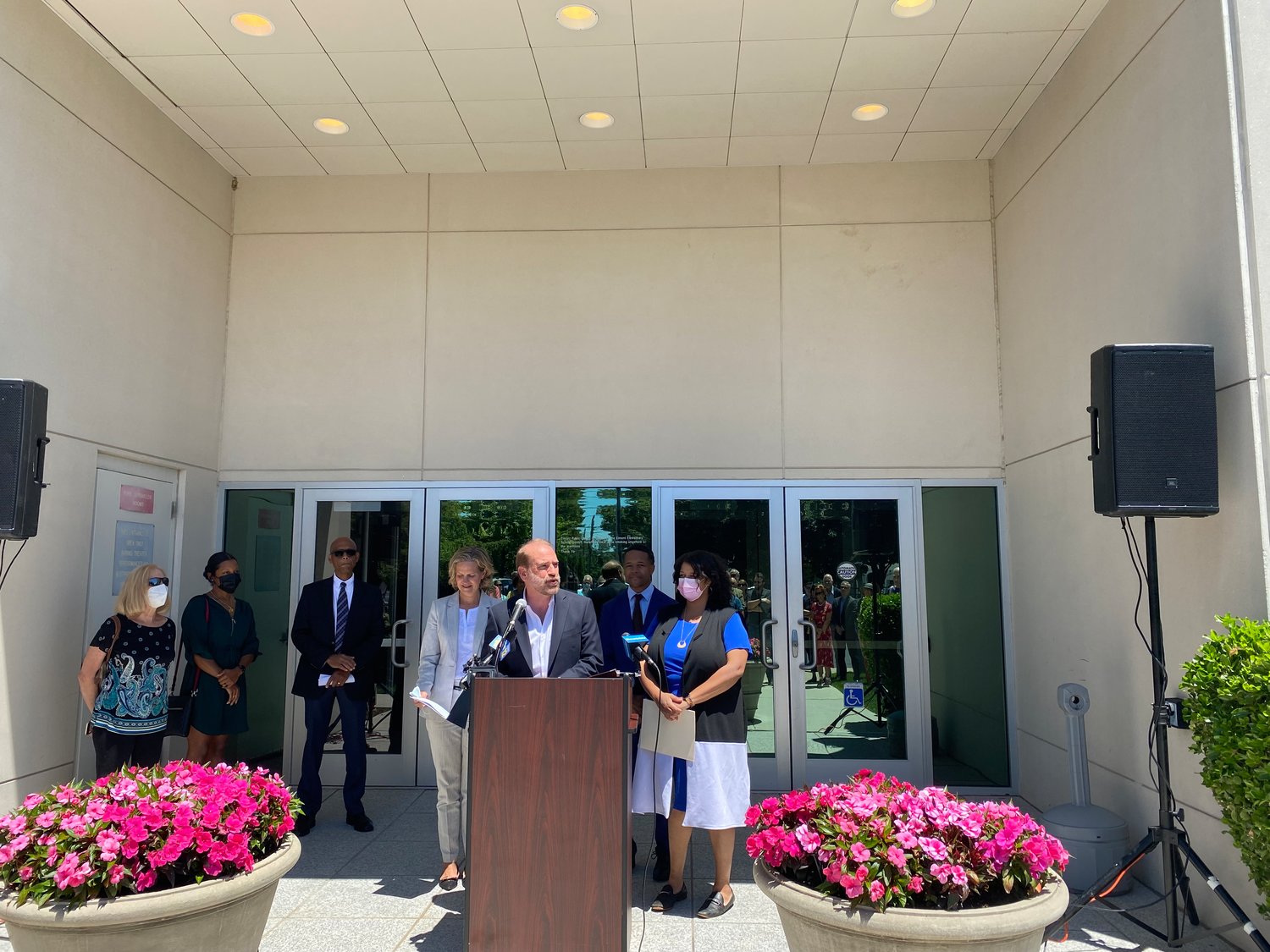 Plaza Theatrical Producer Kevin F. Harrington, left, was joined by Nassau County Executive Laura Curran and Elmont Library Board President Livingston Young on June 23 to announce the opening of a new musical theater.