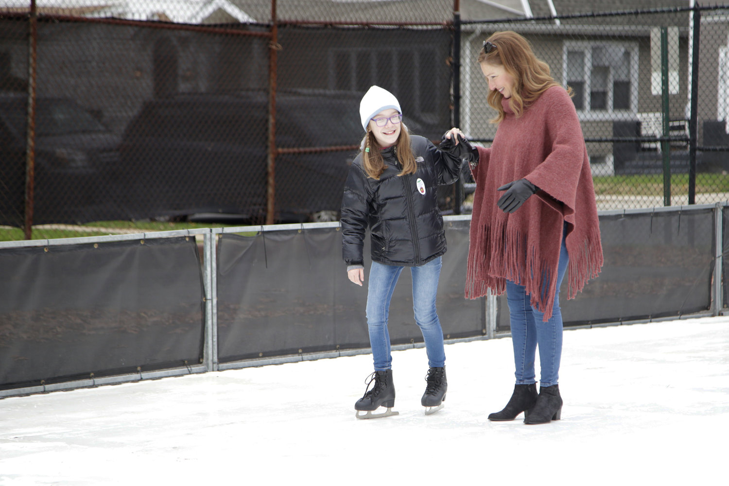 Shelley Schoenfeld and her daughter, Bella, 10,  skated on the synthetic ice rink at Winter Fest.