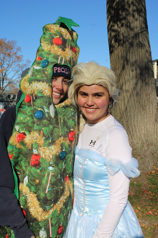 Massapequa High School’s Sara Dupkin, above left, and Lola Cascone, from Kellenberg Memorial High School in Uniondale, dressed as a Christmas tree and Elsa from “Frozen.”