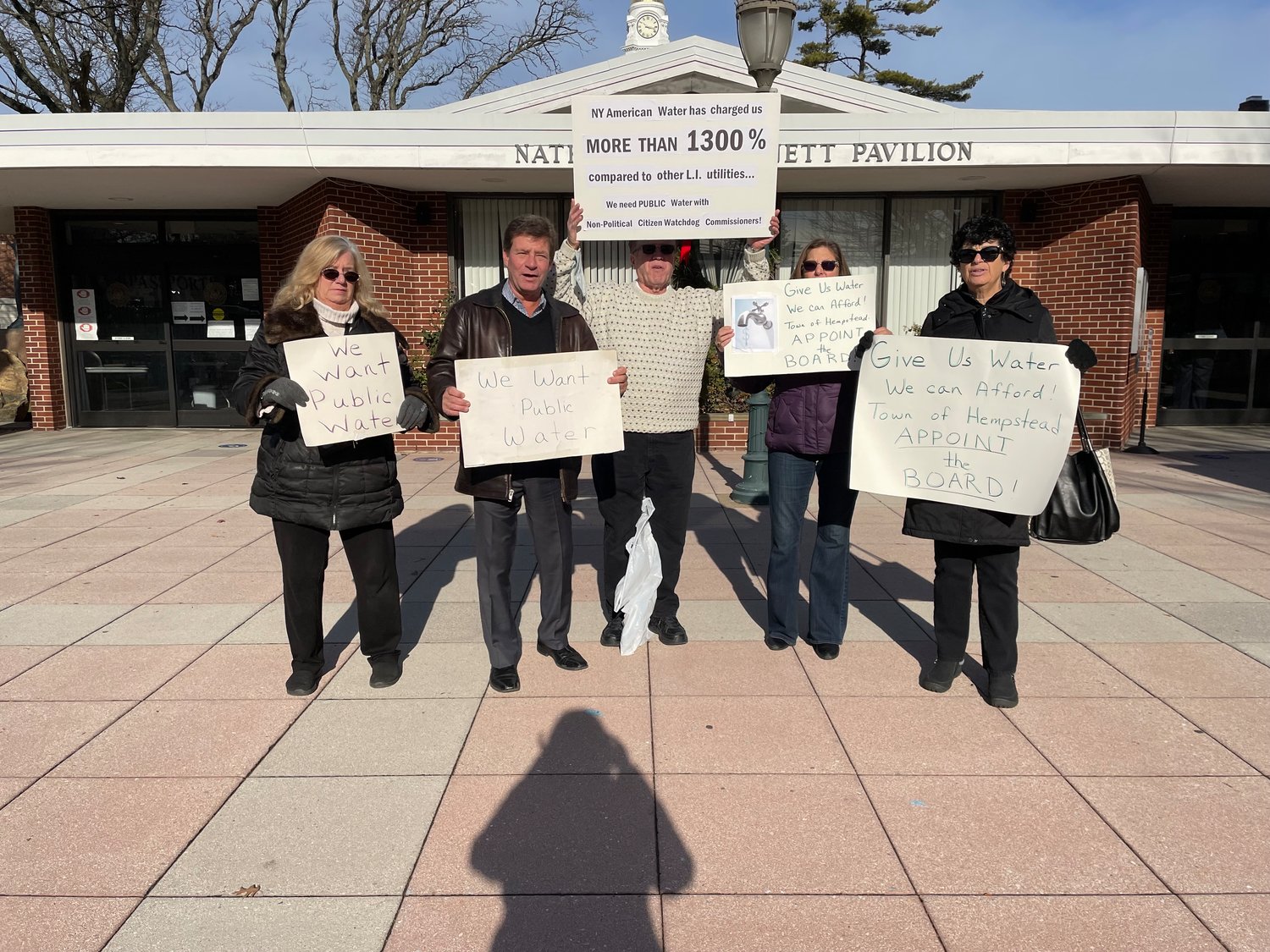 Long Island Clean, Air, Water and Soil co-directors Claudia Borecky and Dave Denenberg, with Jack McCloy, Rosalee Reeves and Helene Manas outside of the town board meeting on Dec. 7.