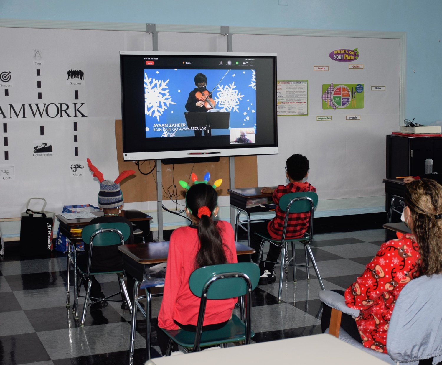 Students tuned in to watch their peers perform holiday songs.