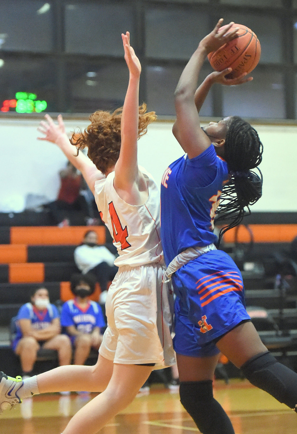 Malverne's Princia Ulysse, right, drove against East Rockaway's Maya Motherway during a Conference B clash won by the Rocks on Jan. 4.