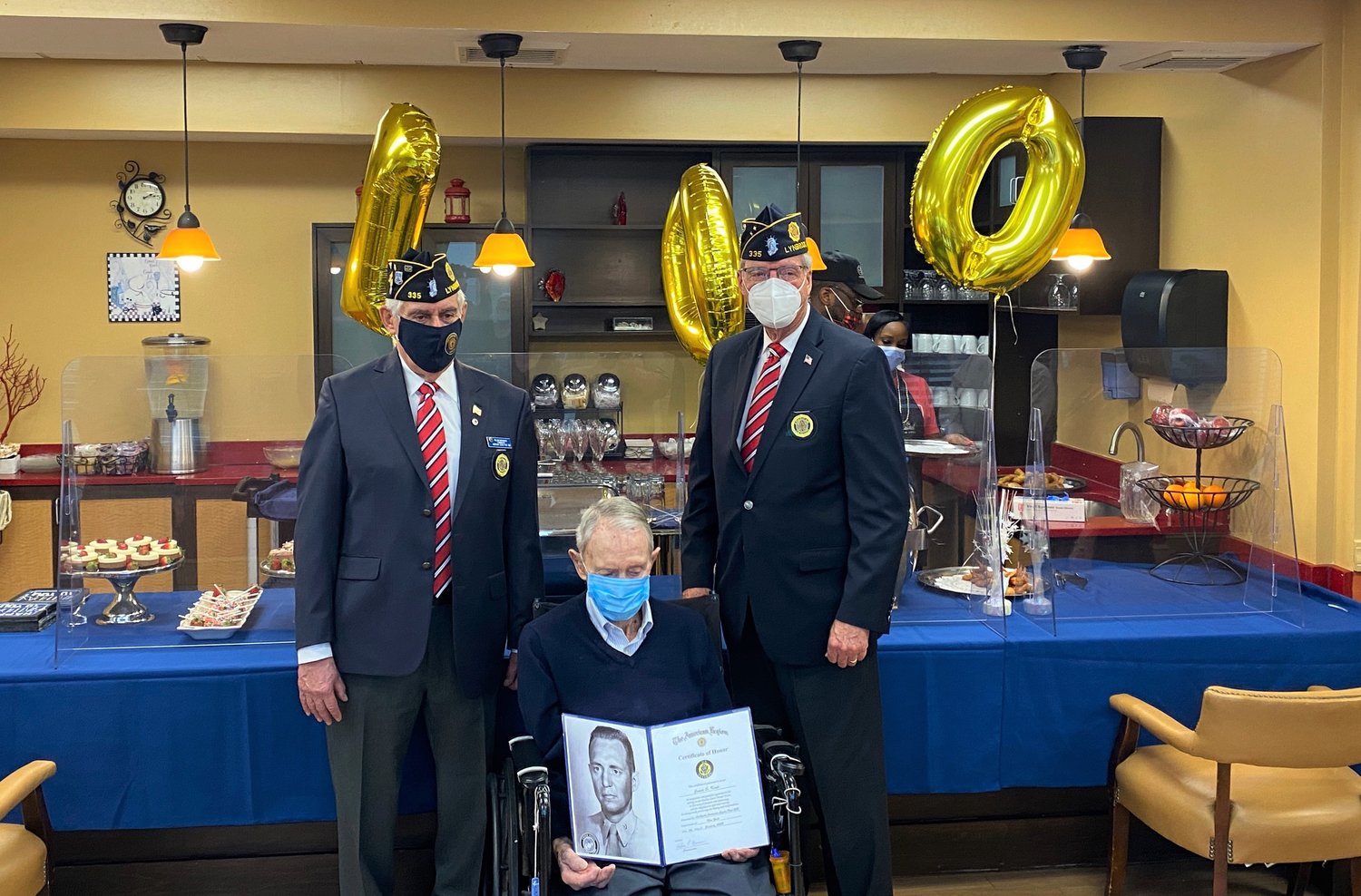Lynbrook American Legion Post 335 Commander Bill Marinaccio, left, and American Legion member and former Village Trustee Steve Grogan presented a Certificate of Honor to Knap.
