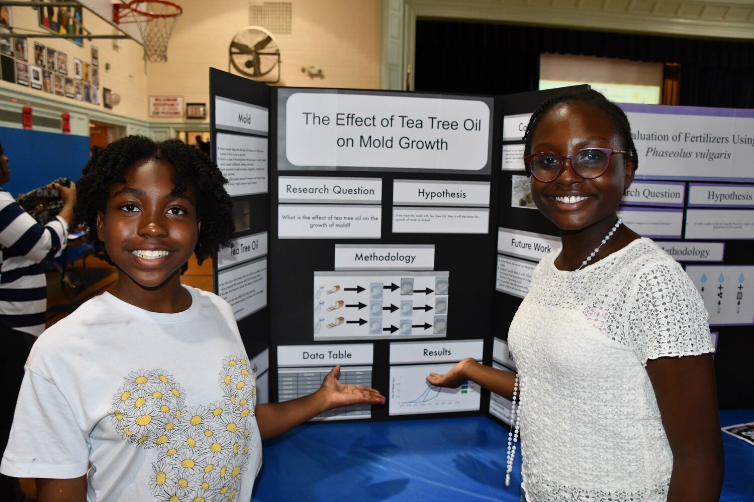 Elmont students present science research projects at symposium in Herald Community Newspapers