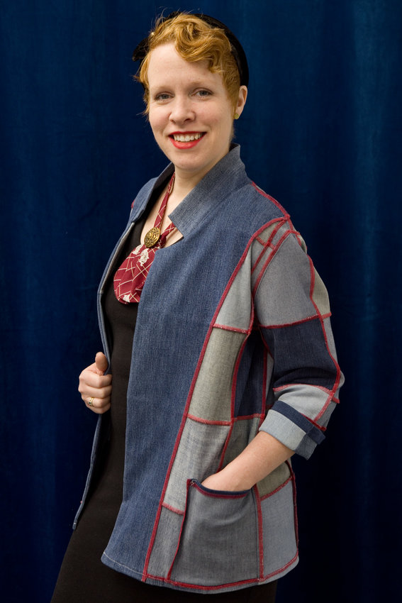 RETHINK owner Kristen McCoy in an upcycled denim blazer. She explained, &ldquo;To upcycle is to add value to something in the processing. We&rsquo;re able to take a worn garment and turn it into something new. We take jeans that are no longer wearable and cut them into denim squares. The result is a reversible blazer that still has a lot of wear. It&rsquo;s on sale at the shop, and is size fluid (small to large).&rdquo;  (Photos by Margie O&rsquo;Loughlin)