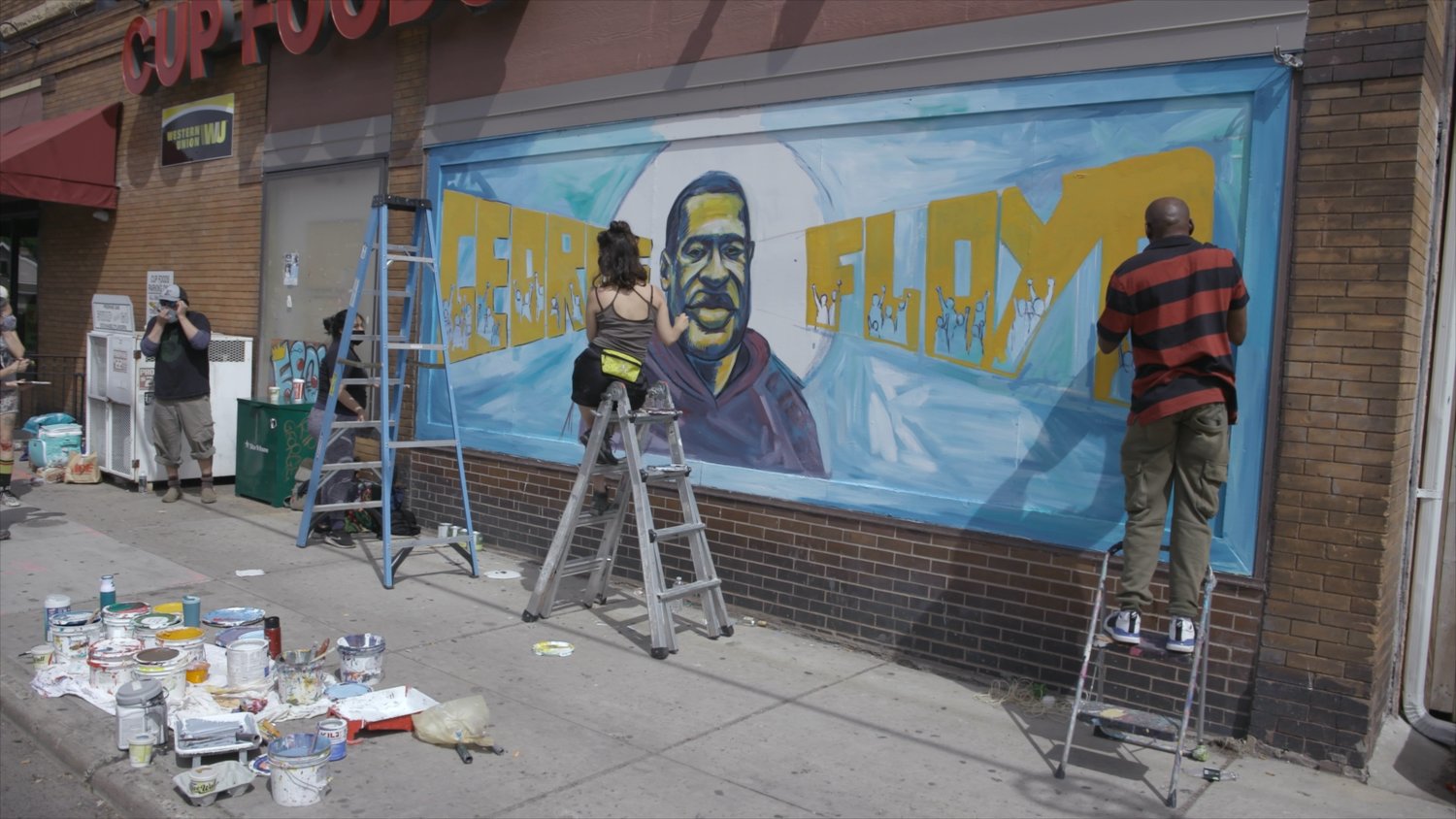 Cy Dodson's film includes footage of the mural being painted on the side of Cup Foods – the mural that is now recognizable across the globe. (Photo submitted)