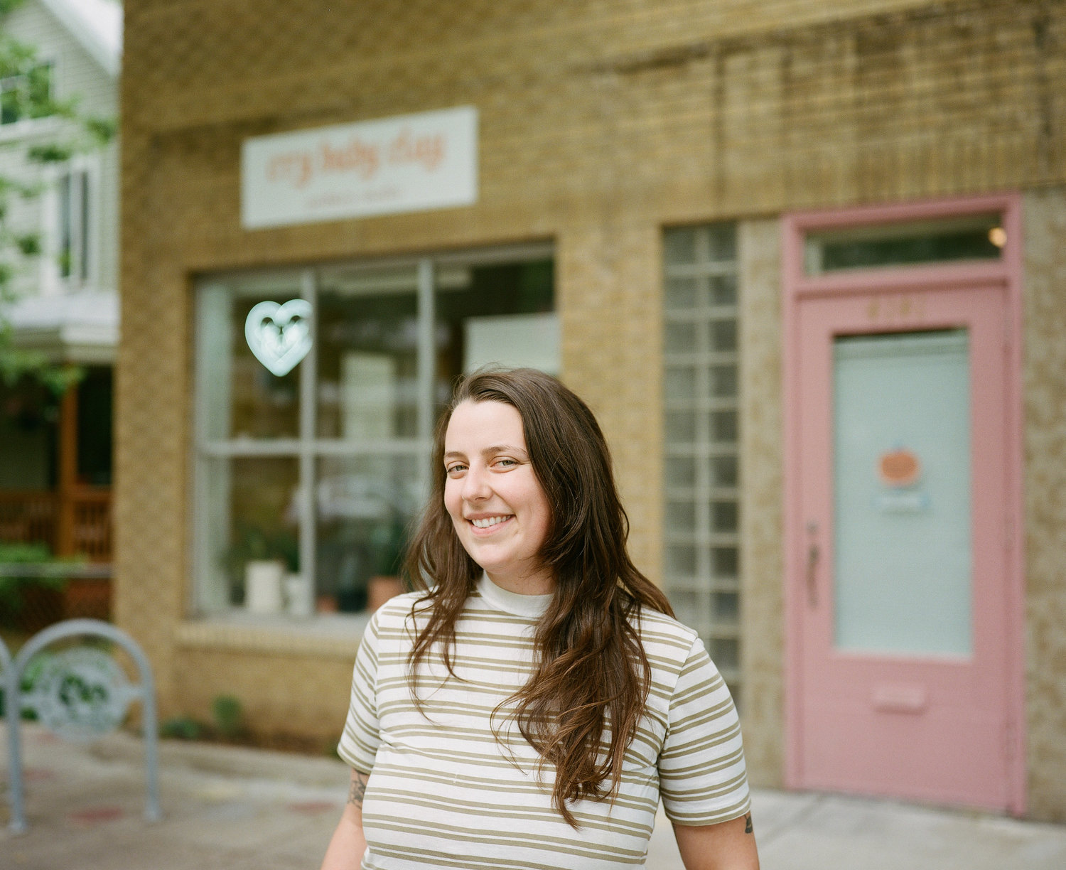 Katie Cameron stands in front of Cry Baby Clay, her newly opened shop on Minnehaha Ave.