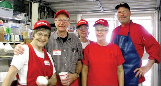 One Midway organization, Hamline Church United Methodist, has had a dining place at the State Fair for 116 years. Above, Elaine Christiansen, Ken Feulner, Monell Jakel, Marge Feulner, and Chef Erik Hendrickson, take a break from the rush of food service at the Fair.