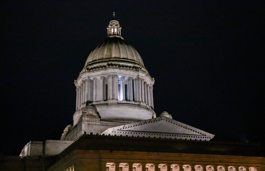 The Washington Capitol building is lit up against the night sky in Olympia on Thursday, Feb. 16, 2023.