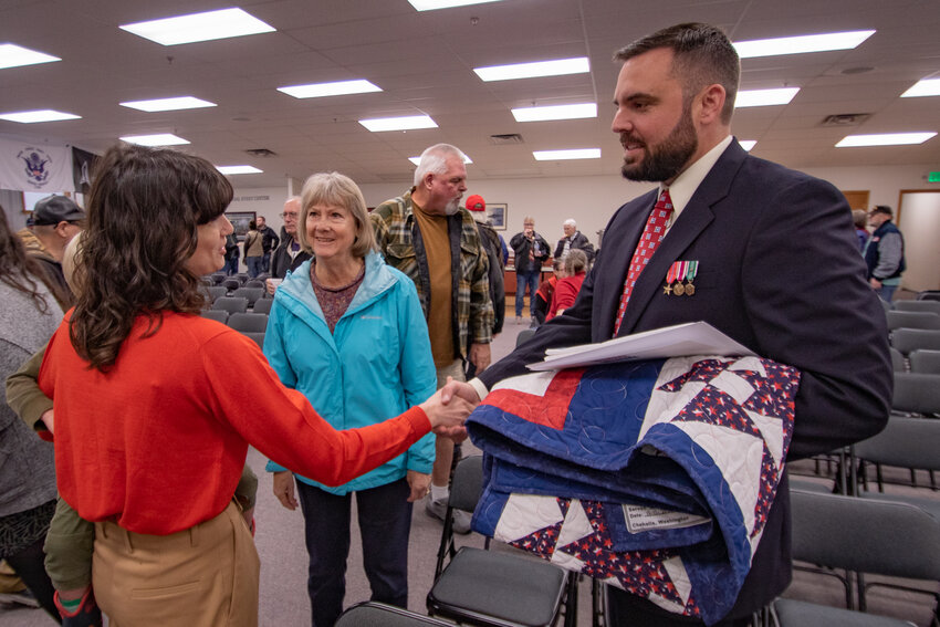 U.S. Congresswoman Marie Gluesenkamp Perez greets a veteran on Saturday, Nov. 11, 2023, at the Veterans Memorial Museum in Chehalis.