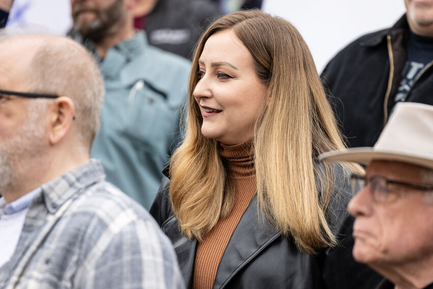 Podcaster Brandi Kruse watches during the &ldquo;Let&rsquo;s Go Washington&rdquo; initiatives rally at the Capitol in Olympia on Friday, Feb. 23, 2024.