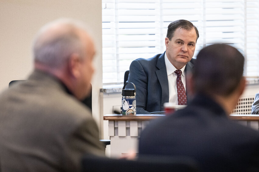 Sen. John Braun listens to Jim Walsh during a public hearing on income tax at the state Capitol on Tuesday, Feb. 27, 2024.