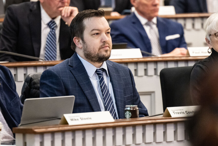Rep. Travis Couture listens during a public hearing on an initiative regarding parental rights in Olympia on Wednesday, Feb. 28, 2024.