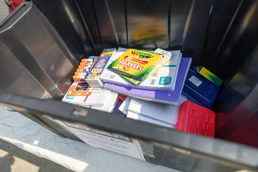 School supplies pile up in a bin for the annual &ldquo;Stuff the Bus&rdquo; drive outside of the Walmart in Chehalis on Friday, Aug. 9.
