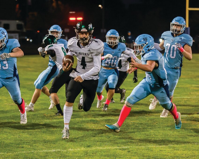 Woodland&rsquo;s Elijah Andersen started the night early with a 60-yard fourth down run blowing past the Hockinson Hawk defenders en route to the end zone during the Woodland Beavers&rsquo; 34-31 win on Friday, Oct. 4.
