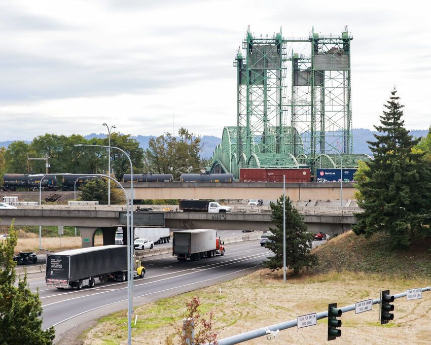 Two semi trucks use the right two lanes of southbound Interstate 5 as they approach the aging bridge spanning the Columbia River. Third Congressional District Rep. Marie Gluesenkamp Perez released a statement on Sept. 20 stating that the bridge design must prioritize increasing vehicular capacity.