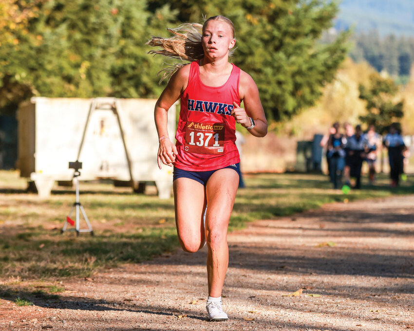 Hockinson High School junior cross country runner Lyla Taylor earned first place against Mark Morris and Woodland high schools during a 2A Greater St. Helens League race at Hockinson Meadows Community Park on Wednesday, Oct. 9.