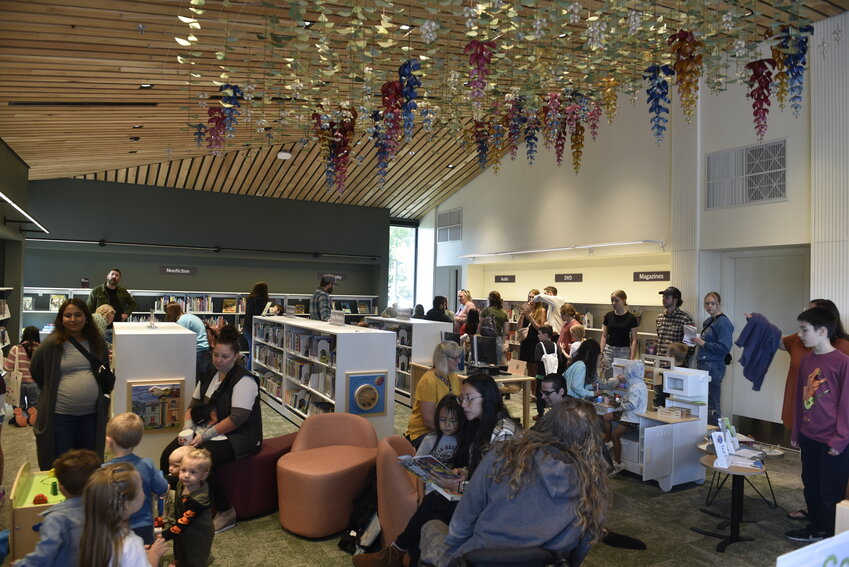 The new children's area in the Woodland Community Library features interactive panels and computer access. Above, the &ldquo;Phonic Bloom&rdquo; art piece, created from recycled books, represents the linguistic commonalities in English, Spanish and Salish. The art piece was created by SuperFab from Portland.