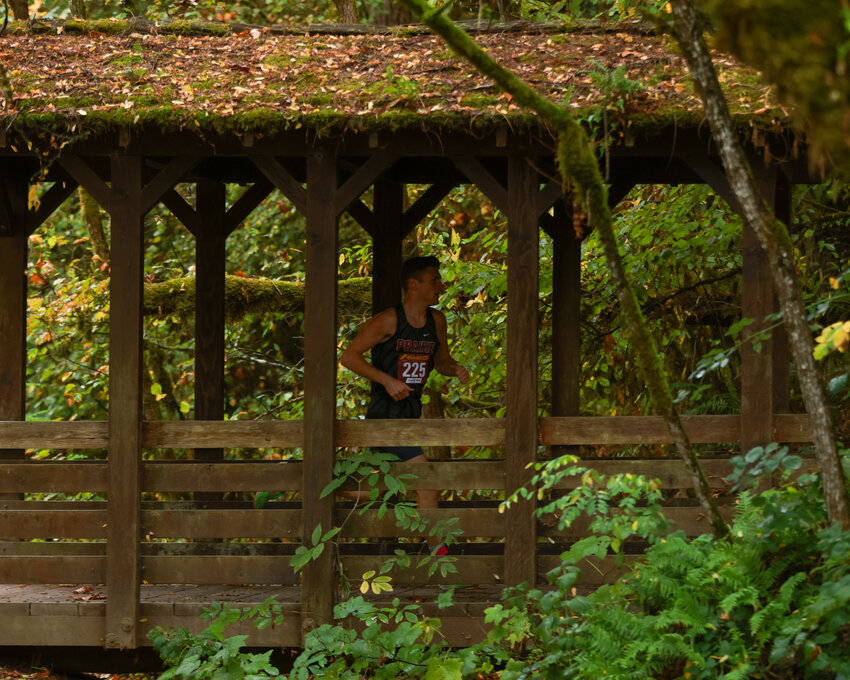 Prairie senior cross country runner Dekota Houfek secured first place on the 4,600-meter course at Lewisville Park with a time of 16:21.73 to help the boys team secure a 3A Greater St. Helens League title on Tuesday, Oct. 15, with a win over Evergreen High School.