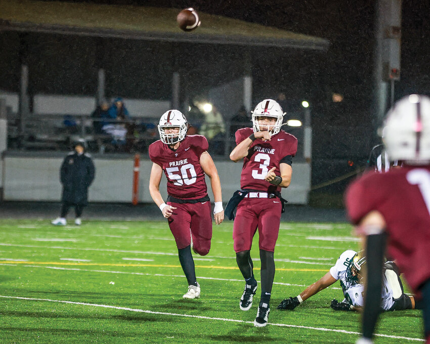 Prairie quarterback Deven Vigue, 3, throws the ball during the Falcons' 36-7 loss to the Evergreen Plainsmen on Friday, Oct. 18.