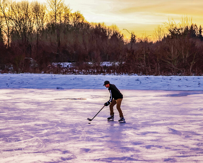 Last winter, a rare scene took place near the Battle Ground Walmart as over a dozen local hockey players took advantage of the frozen water to play pond hockey.
