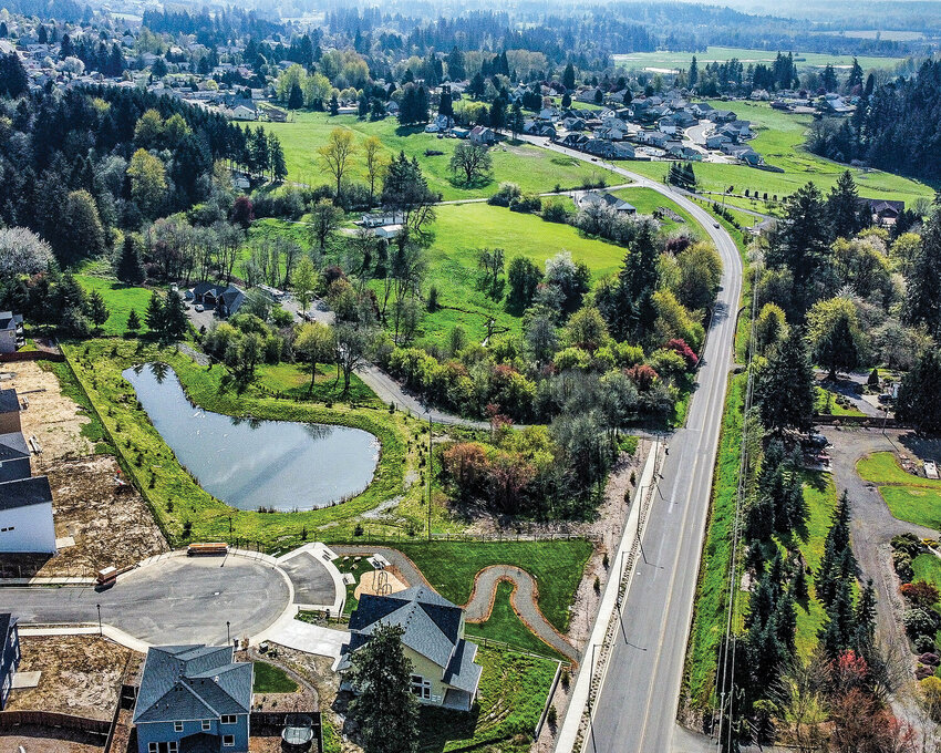 Designs for a shared-use path on Pacific Highway in La Center are 75% complete. The 10-foot-wide path aims to improve pedestrian and bicycle access between neighborhoods and downtown. However, the project's funding is uncertain, as $1 million in state funds could be lost depending on the outcome of Initiative 2117 on the general election ballot.