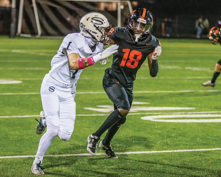 Battle Ground's Trent Richardson covers Skyview's Micah Robison during the Tigers&rsquo; 43-0 homecoming loss on Friday, Oct. 25.