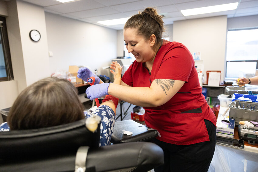 Red Cross employee Brianna Buchanan wraps Shari Watt&rsquo;s arm after donating blood at an American Red Cross blood drive in the Lewis County Courthouse in Chehalis on Tuesday, Oct. 29, 2024.
