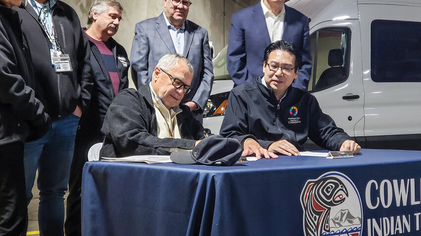 Cowlitz Indian Tribe Chairman William Iyall, left, and Washington Department of Commerce Director Mike Fong (right) signed a memorandum of understanding affirming the Tribe and state&rsquo;s commitment to clean energy initiatives. Since 2022, the state has invested over $8.4 million for the tribe&rsquo;s clean energy projects.
