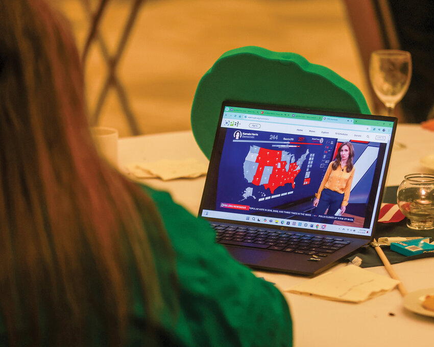 An attendee at the Democratic election watch party in Vancouver Tuesday, Nov. 8, keeps an eye on the presidential election from her laptop.