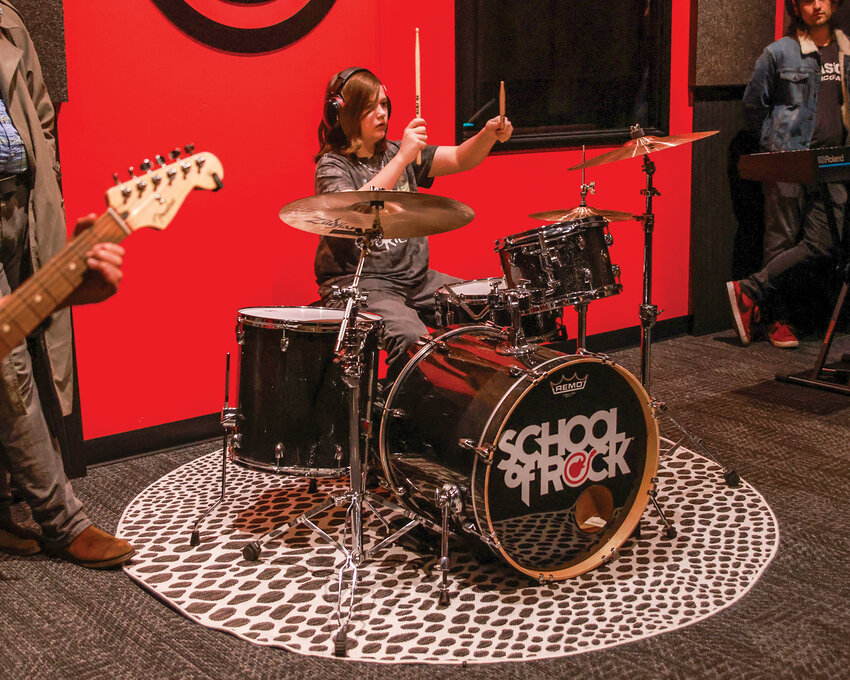 Vancouver School of Rock&rsquo;s performance program Best of the &rsquo;90s student Jeremiah C. bangs the drum sticks together as the group gets begins rehearsal on Wednesday, Nov. 6.