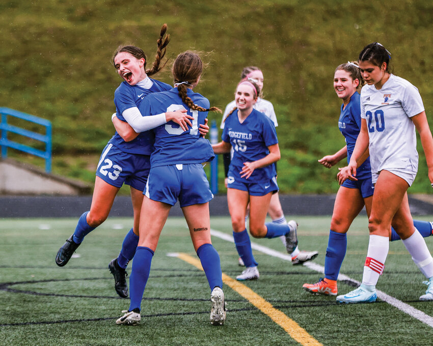 Ridgefield senior Abigail Vance, No. 23, celebrates a rare goal for herself in the Spudders&rsquo; 5-0 quarterfinal win over Fife High School on Saturday, Nov. 16.