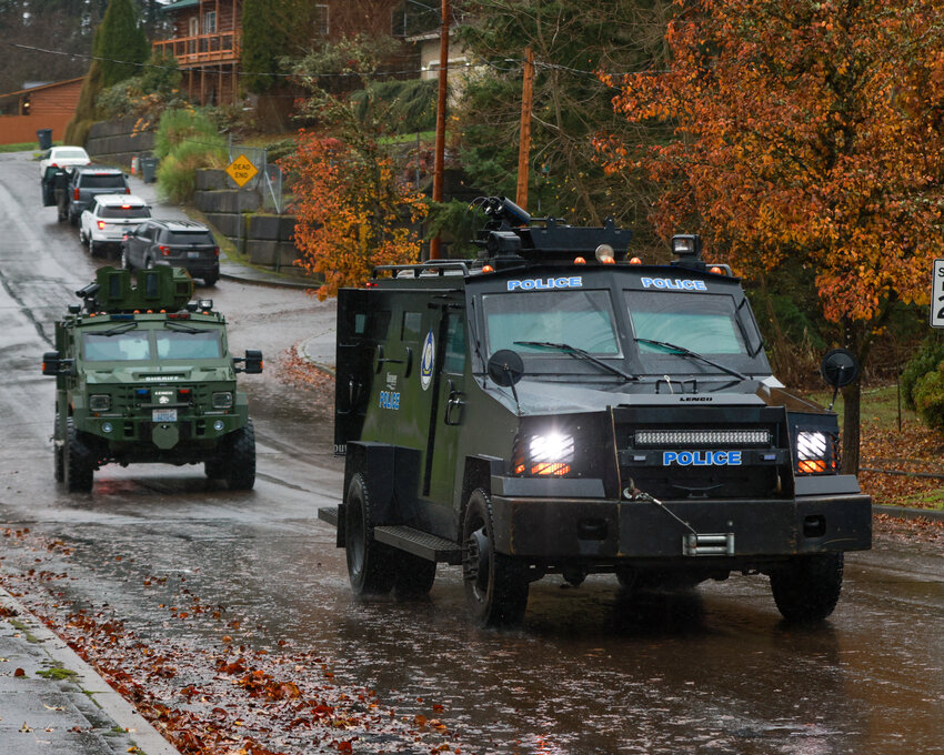 A Vancouver Police Department and Clark County Sheriff's Office SWAT vehicle heads back to a staging area during an incident at a La Center home around noon on Sunday, Nov. 24.
