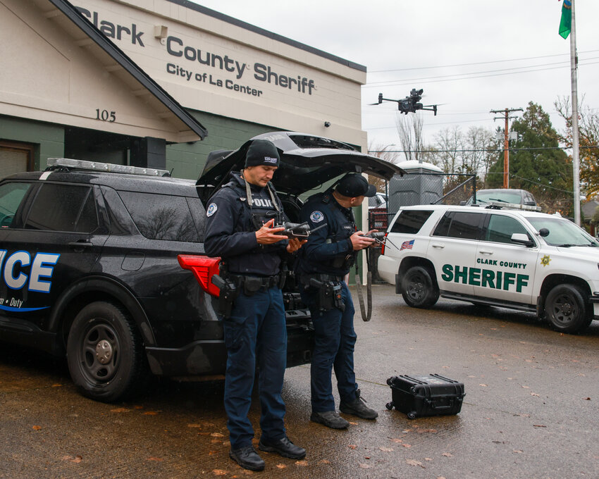 Two Vancouver Police Department officers fly drones during an incident at a La Center home around noon on Sunday, Nov. 24.