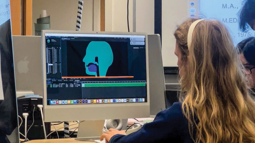Washington State University Vancouver student Evan Leyden tests his animation of a 3D model depicting the human mouth and vocal cords, demonstrating how different phonetic sounds are produced. The animation will be part of an interactive phone app teaching Woodland Community Library visitors about speech patterns used in English, Spanish and Cowlitz-spoken Salish.