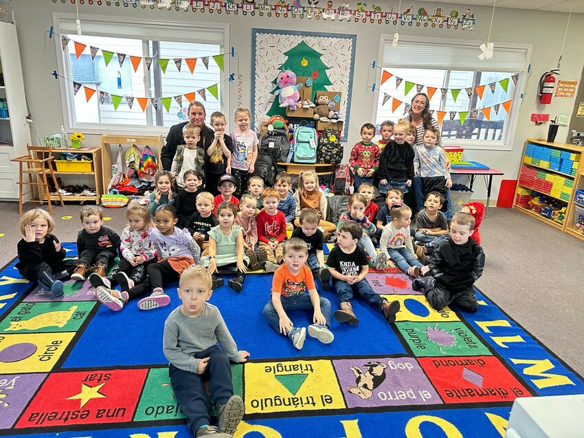 Packing foster care boxes for the Washington State Department of Children, Youth &amp; Families provides an opportunity to teach Woodland Co-op Preschool students the value of kindness and giving.