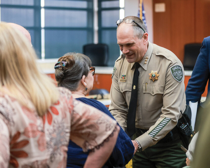 Clark County Sheriff John Horch greeted a family member of a fallen officer after the Clark County Law Enforcement Memorial Ceremony on May 22, 2024.